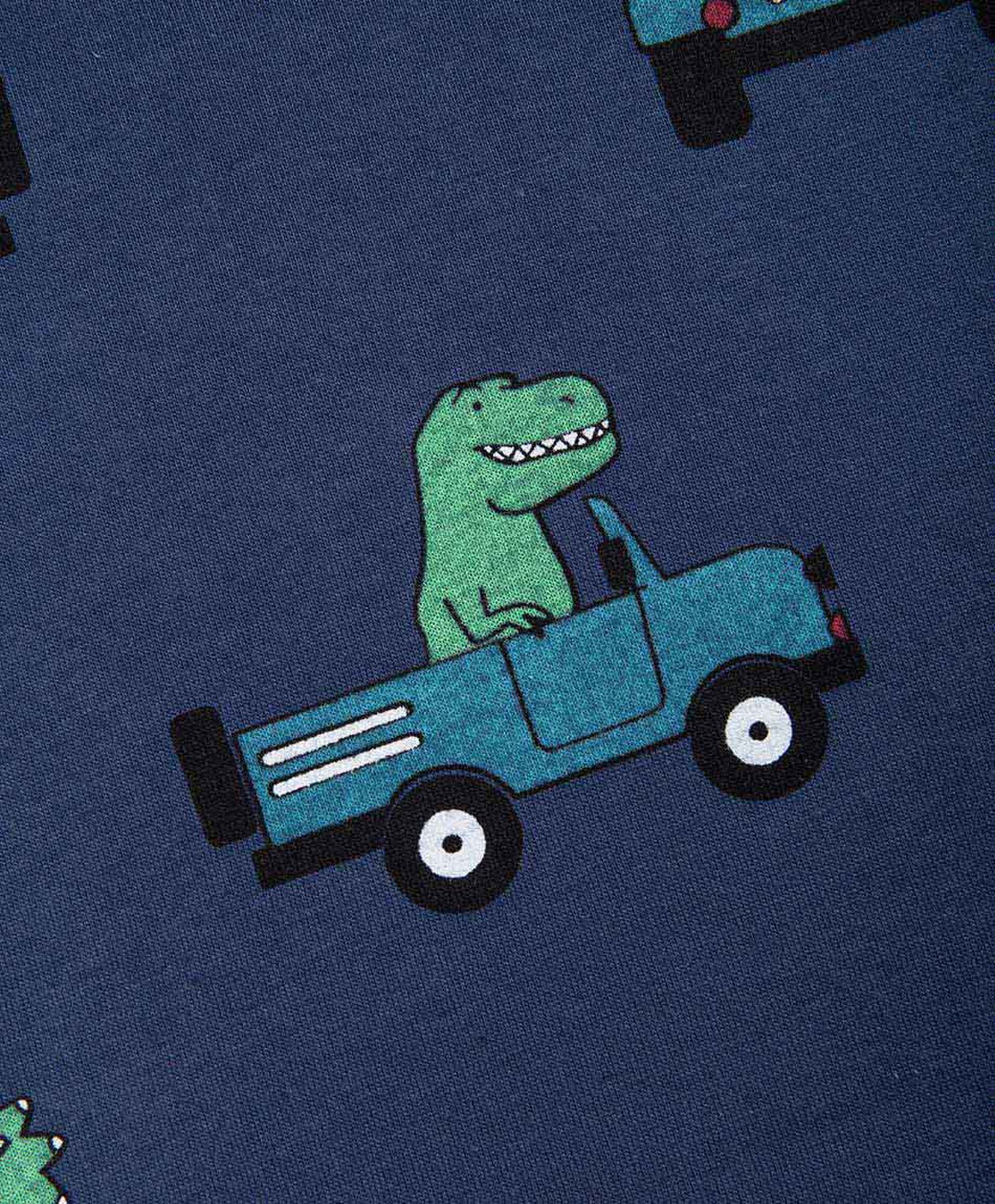 Polera bebé dinosaurios en auto Polera bebé dinosaurios en auto