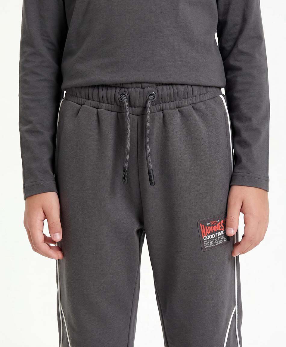 Pantal&oacute;n buzo ni&ntilde;o l&iacute;neas blancas