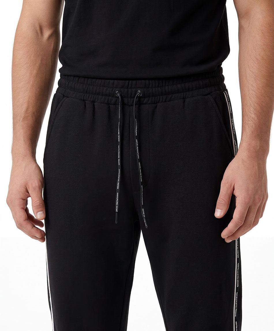 Pantal&oacute;n deportivo hombre l&iacute;neas piping
