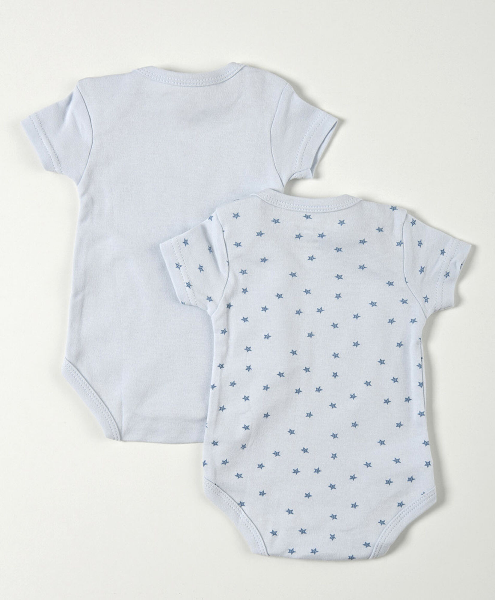 Pack 2 bodies bebé azul liso y estrellas Pack 2 bodies bebé azul liso y estrellas