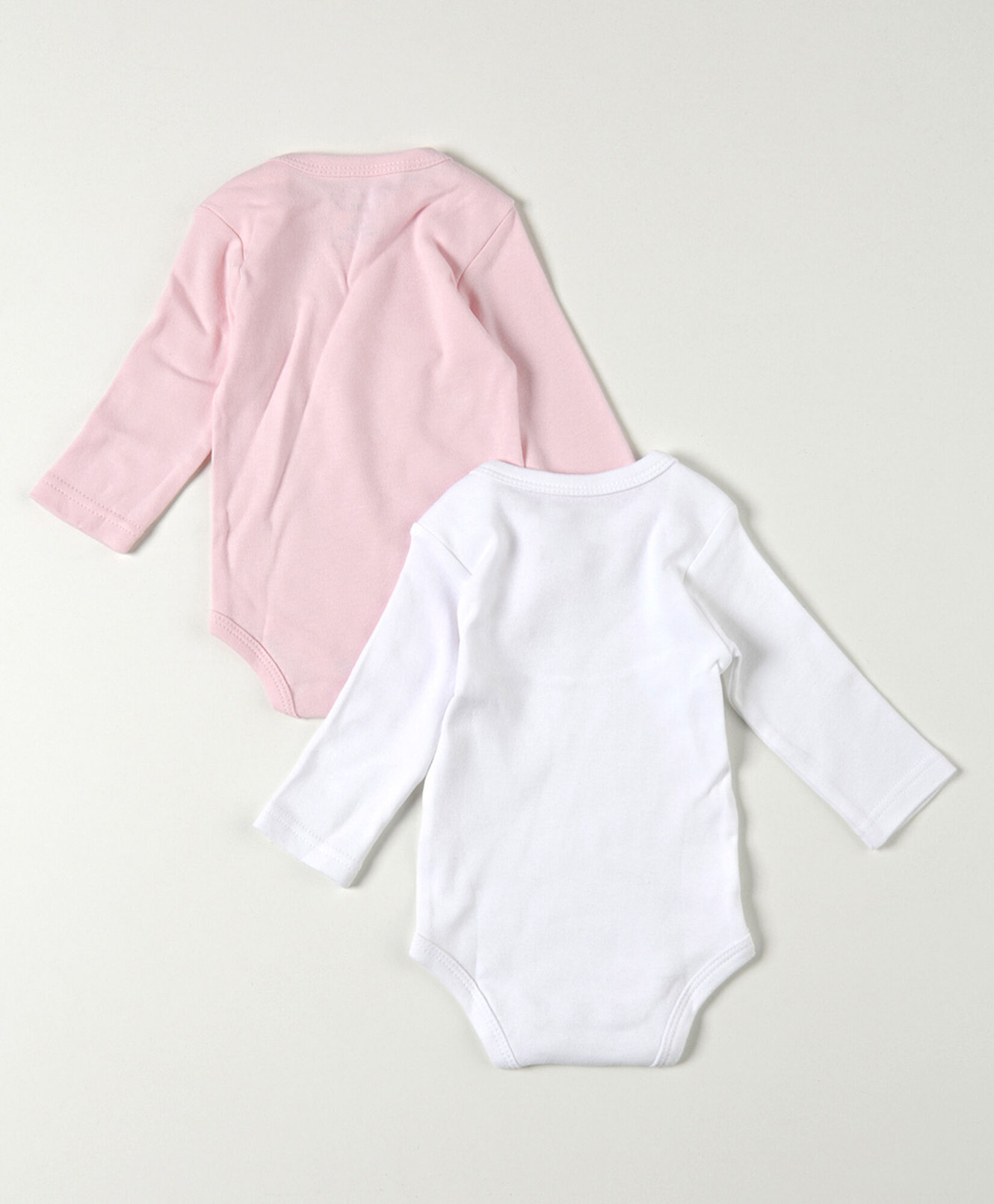Pack 2 bodies bebé blanco y rosado manga larga Pack 2 bodies bebé blanco y rosado manga larga