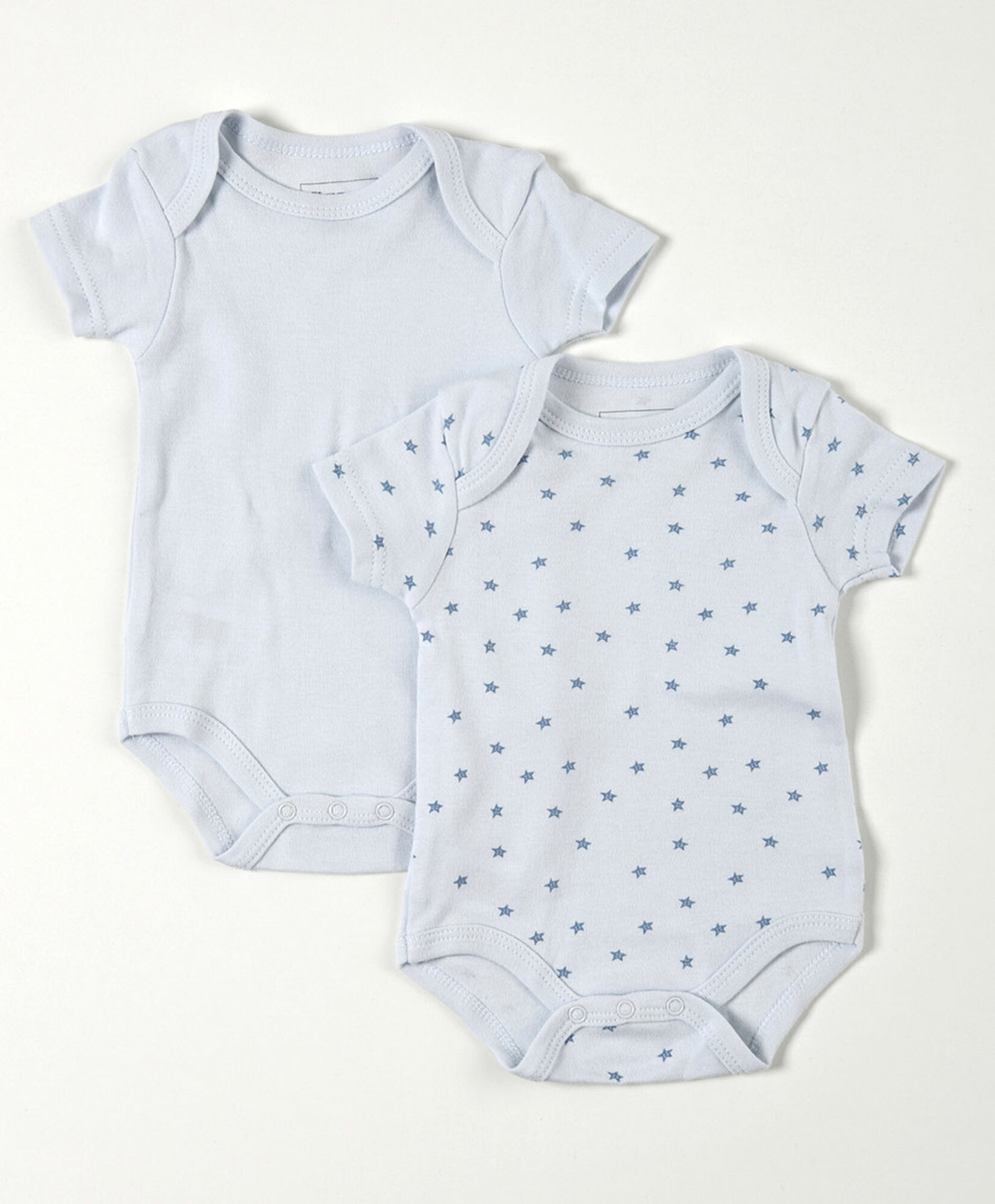 Pack 2 bodies bebé azul liso y estrellas Pack 2 bodies bebé azul liso y estrellas