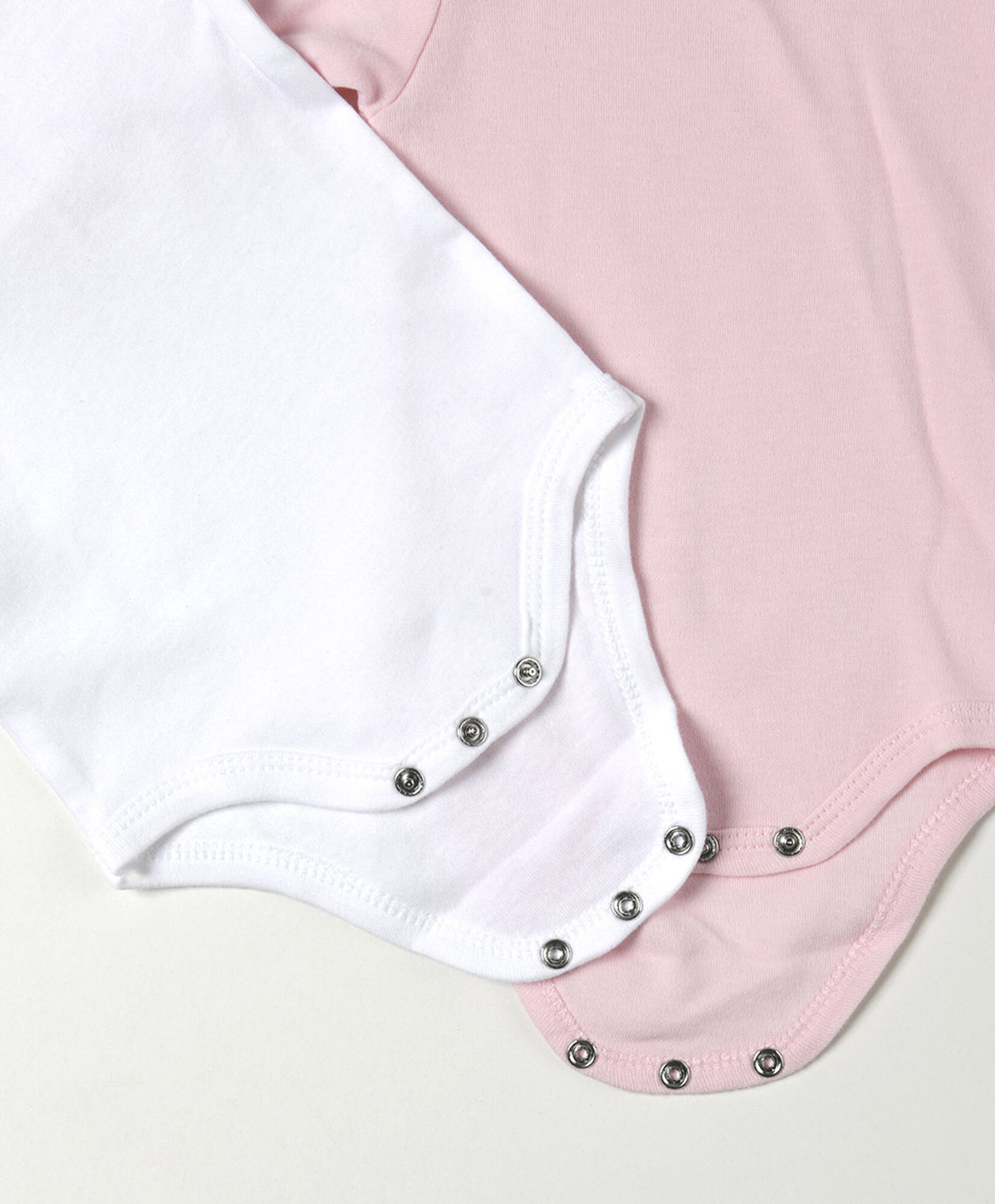 Pack 2 bodies bebé blanco y rosado manga larga Pack 2 bodies bebé blanco y rosado manga larga