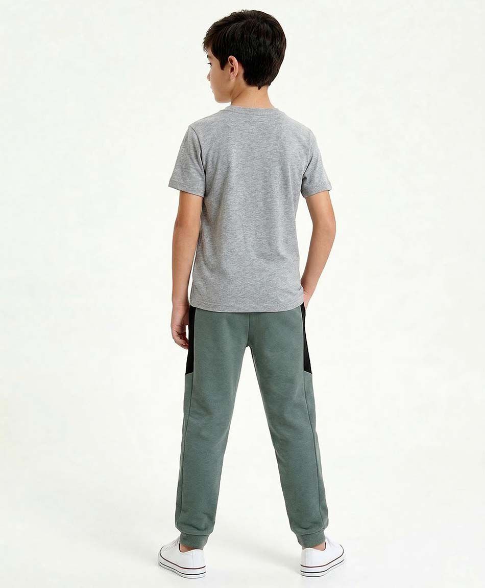 Pantal&oacute;n buzo ni&ntilde;o l&iacute;nea lateral