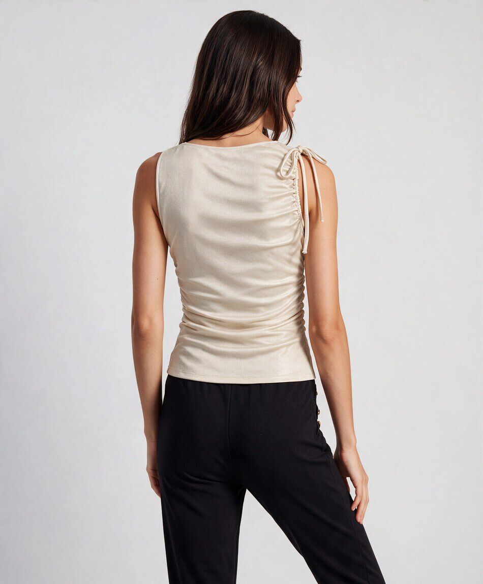 Polera mujer dorada lazo