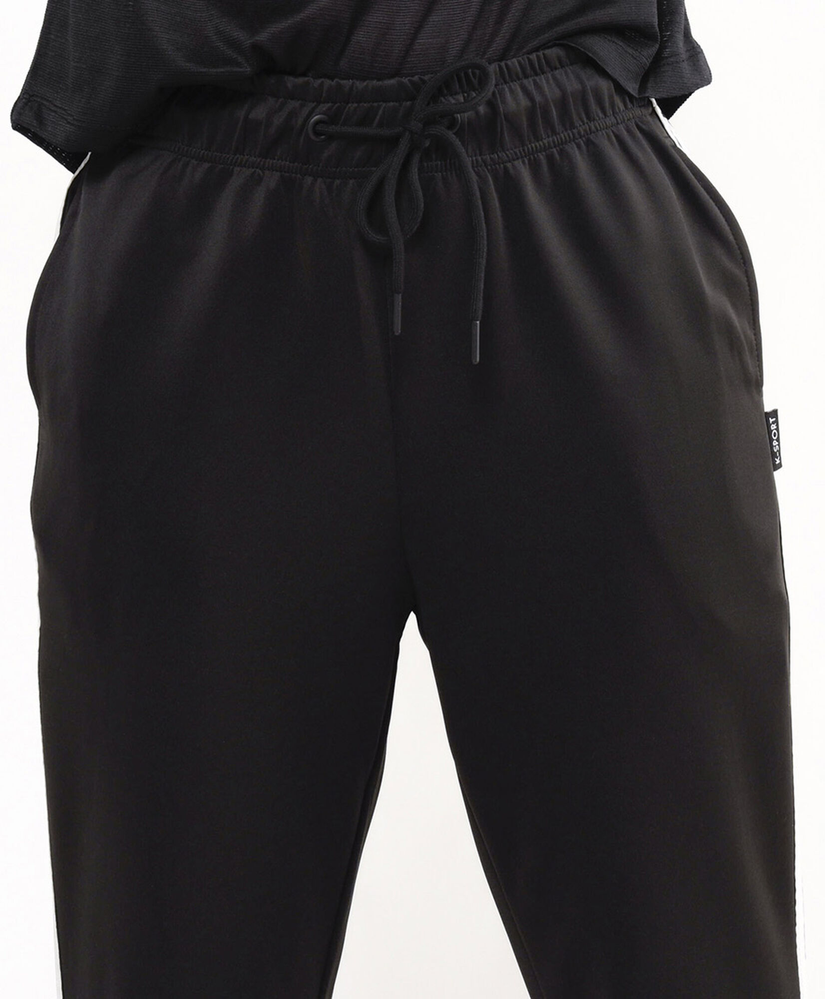 Pantalón deportivo mujer con líneas laterales Pantalón deportivo mujer con líneas laterales