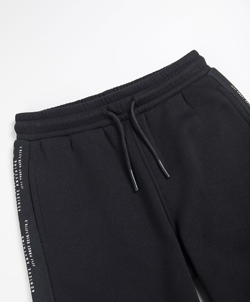 Pantal&oacute;n buzo ni&ntilde;o frase lateral