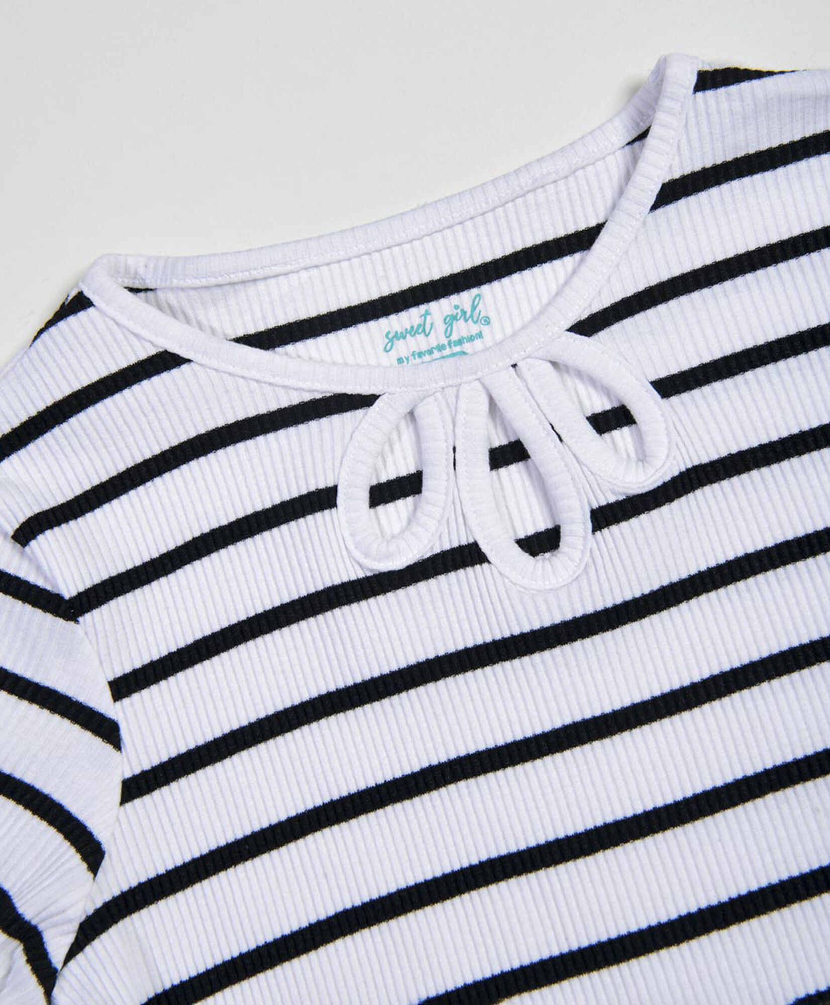Polera niña líneas lazo Polera niña líneas lazo